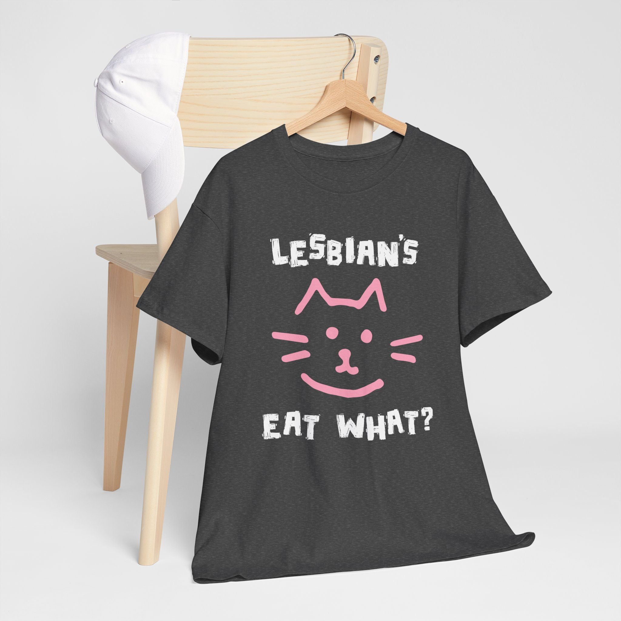 Dark heather t-shirt with wide-eyed cat face and Lesbians Eat What? phrase, bold and cheeky design