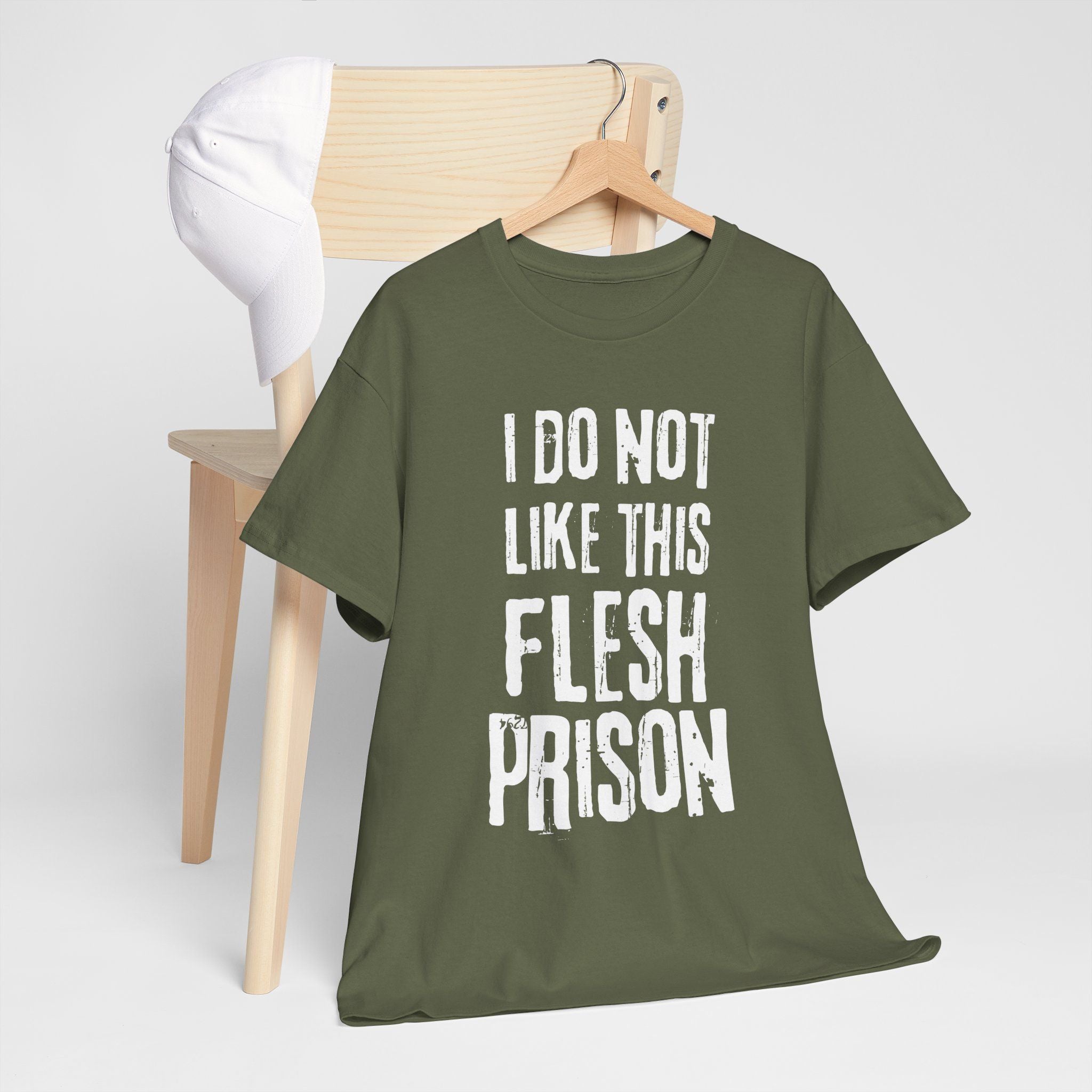 Military green t-shirt with warped gothic font reading I Do Not Like This Flesh Prison, dark humor existential tee