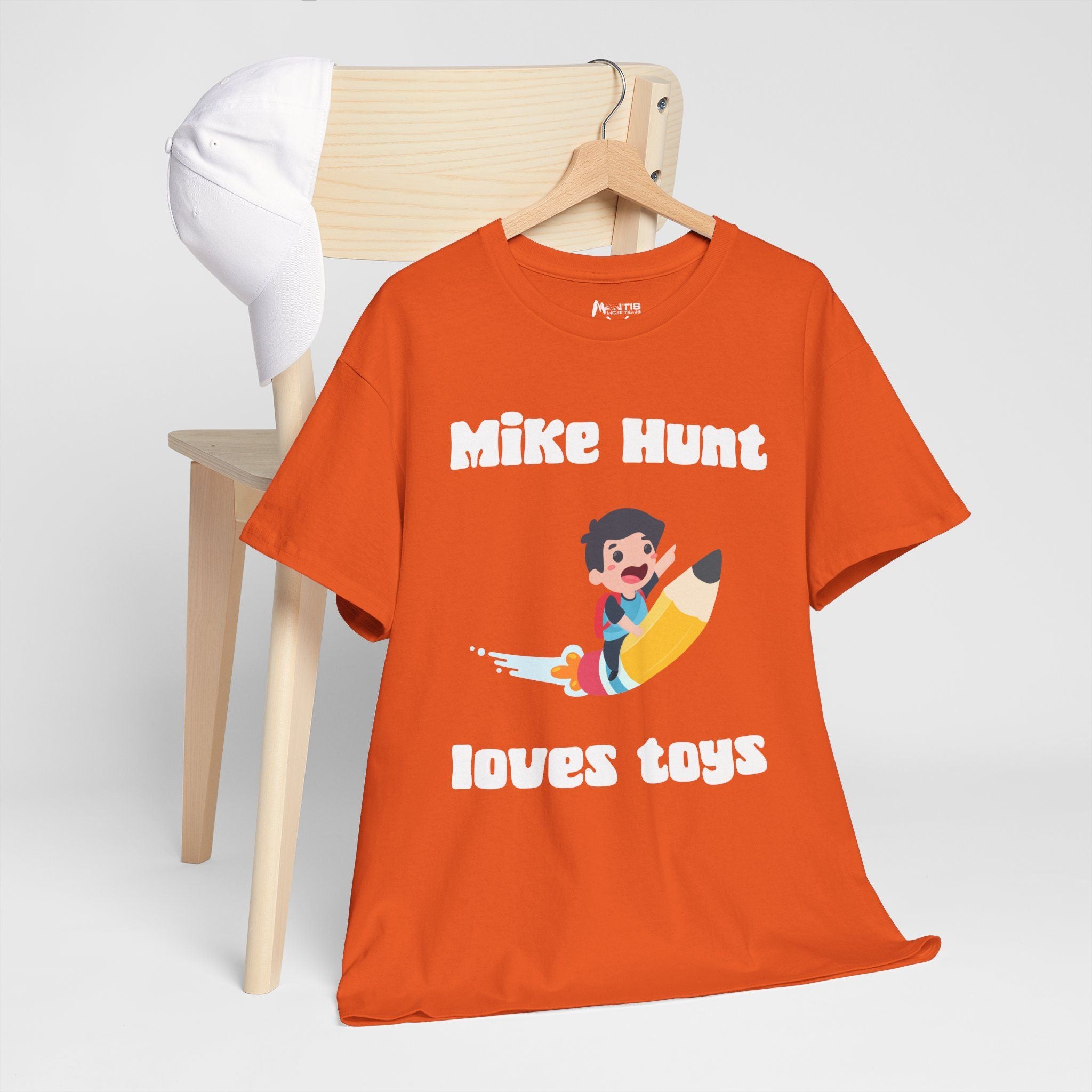 Orange tee disguising sexual content in a cartoon-colored package